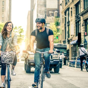 Couple of cyclist in New York - Couple of lovers sighseeing Manhattan on bikes